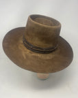 Handmade Spencer Dutton hat from the 1923 series in dark brown beaver felt with an outer laced leather band.