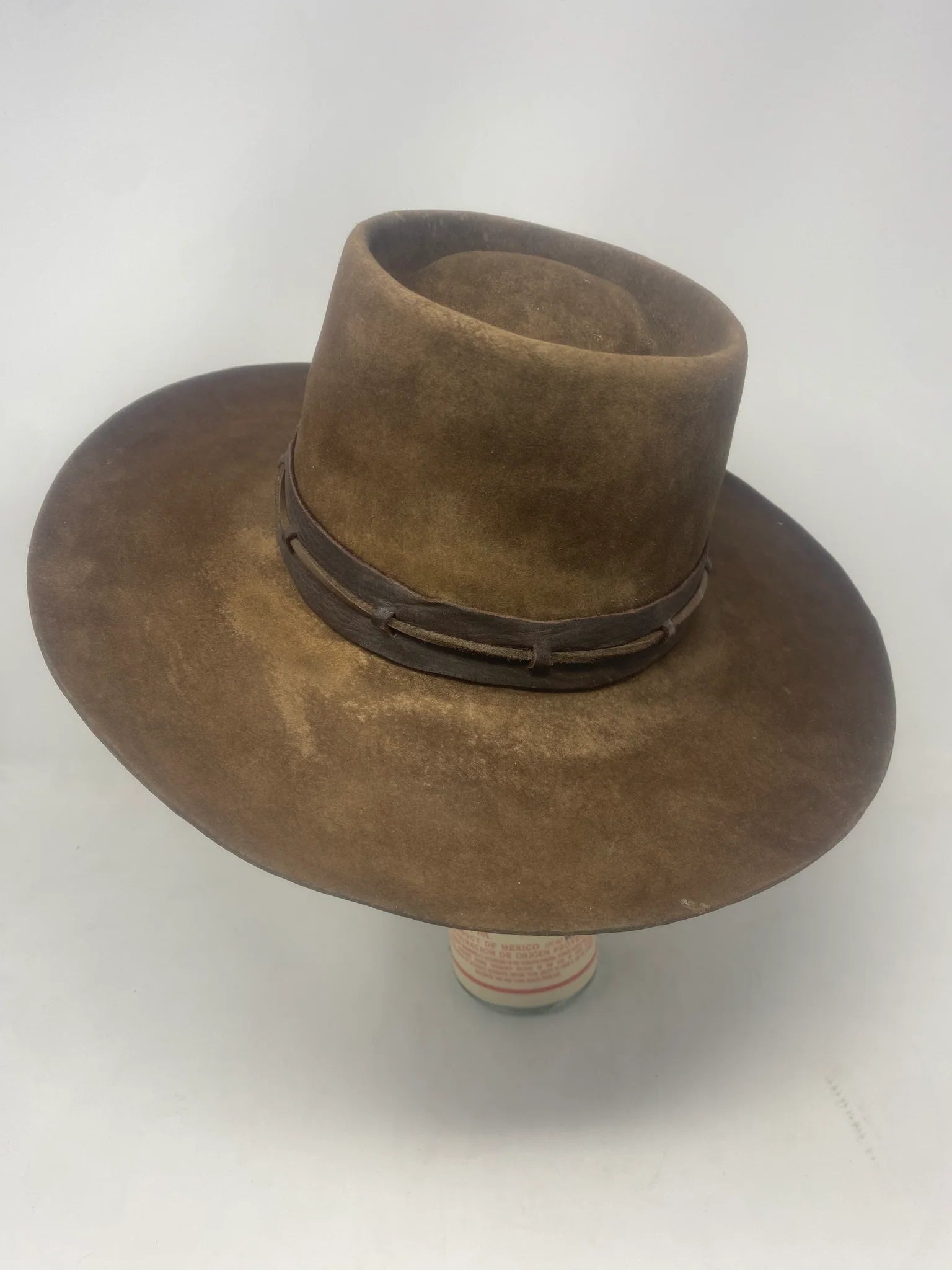Handmade Spencer Dutton hat from the 1923 series in dark brown beaver felt with an outer laced leather band.