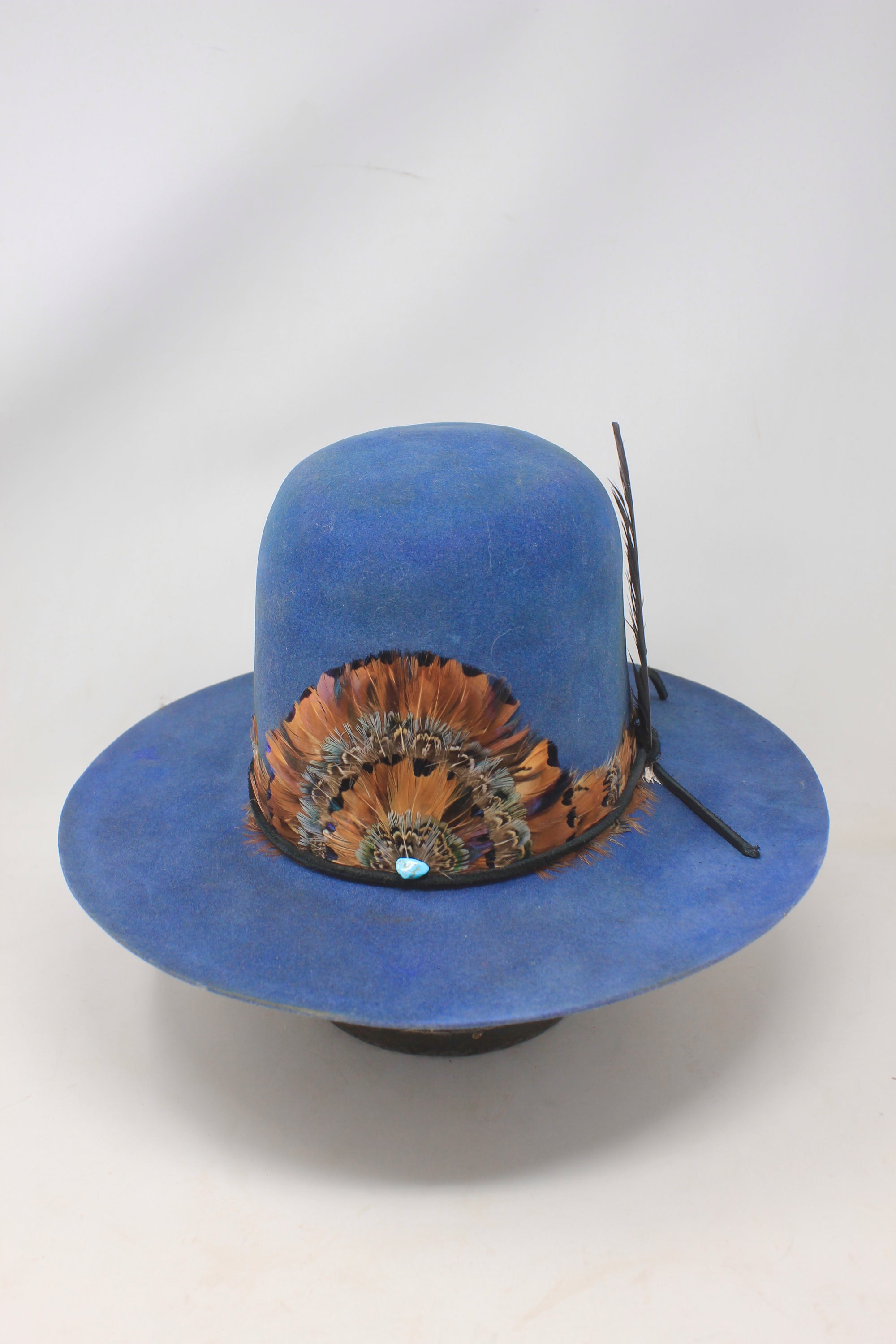 Front view of the  LH Open Crown Feather Band hat by Lone Hawk Hats featuring royal blue fur blend felt, an open crown, medium brim, and handmade feather banding.

