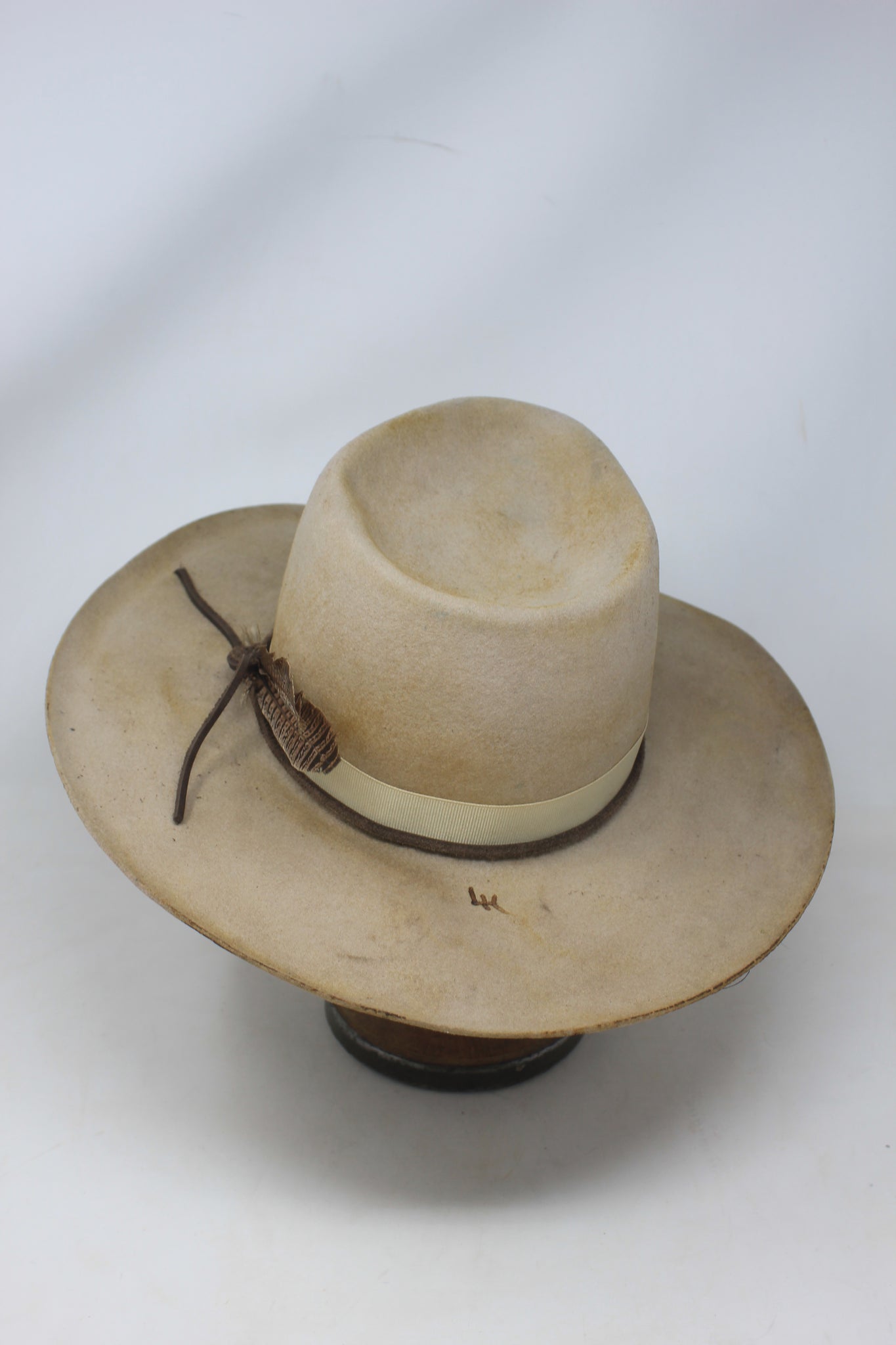 top back view of the LH Blond Pinch hat by Lone Hawk Hats featuring blond fur blend felt, a mid-size pinched crown, hand-stitched band, and light distressing.