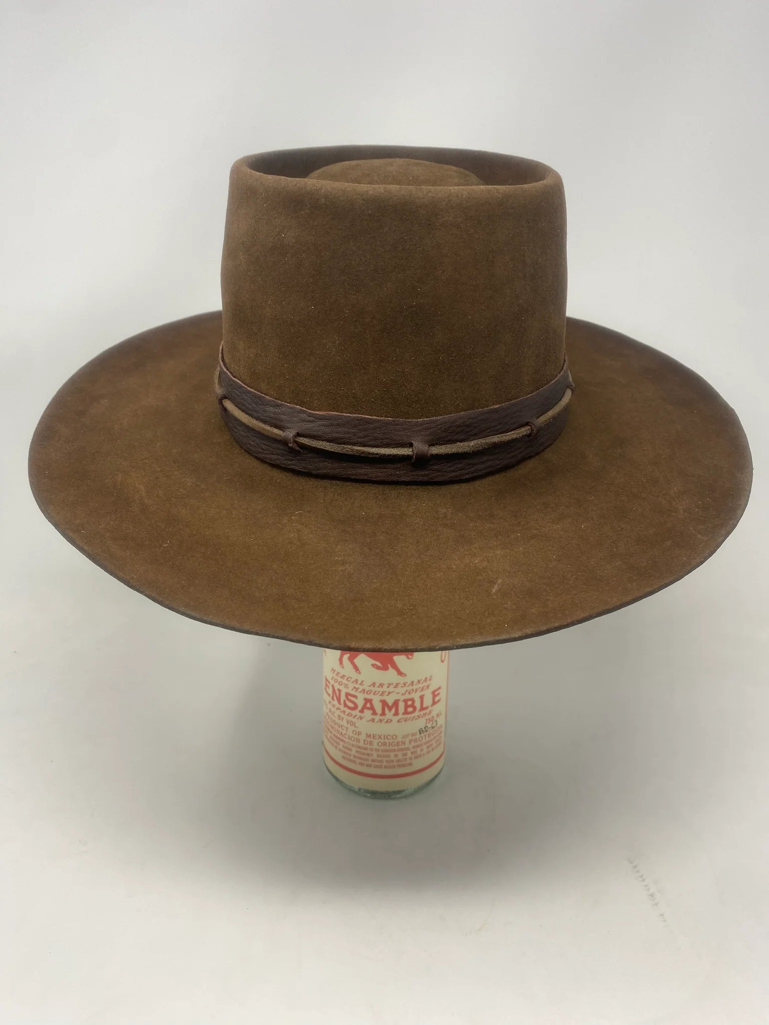 Handmade Spencer Dutton hat from the 1923 series in dark brown beaver felt with an outer laced leather band.