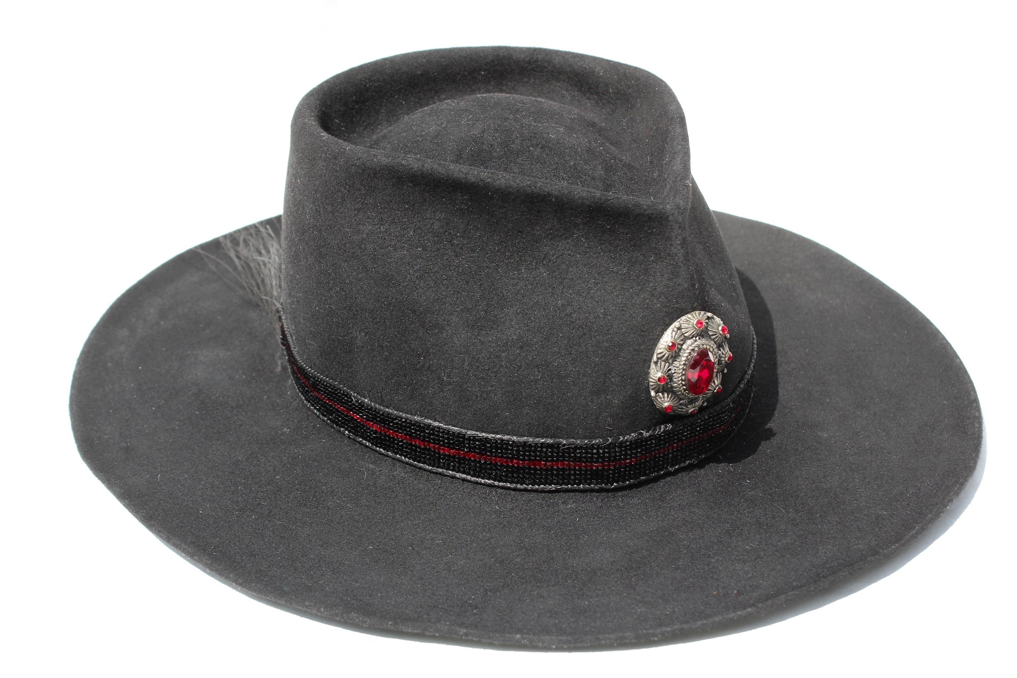 Right view of The Saturday Night Fever custom Lone Hawk hat, a handmade beaver fur blend western hat featuring a tall tear-drop crown, hand-beaded band with horsehair detail, and antique English medallion.