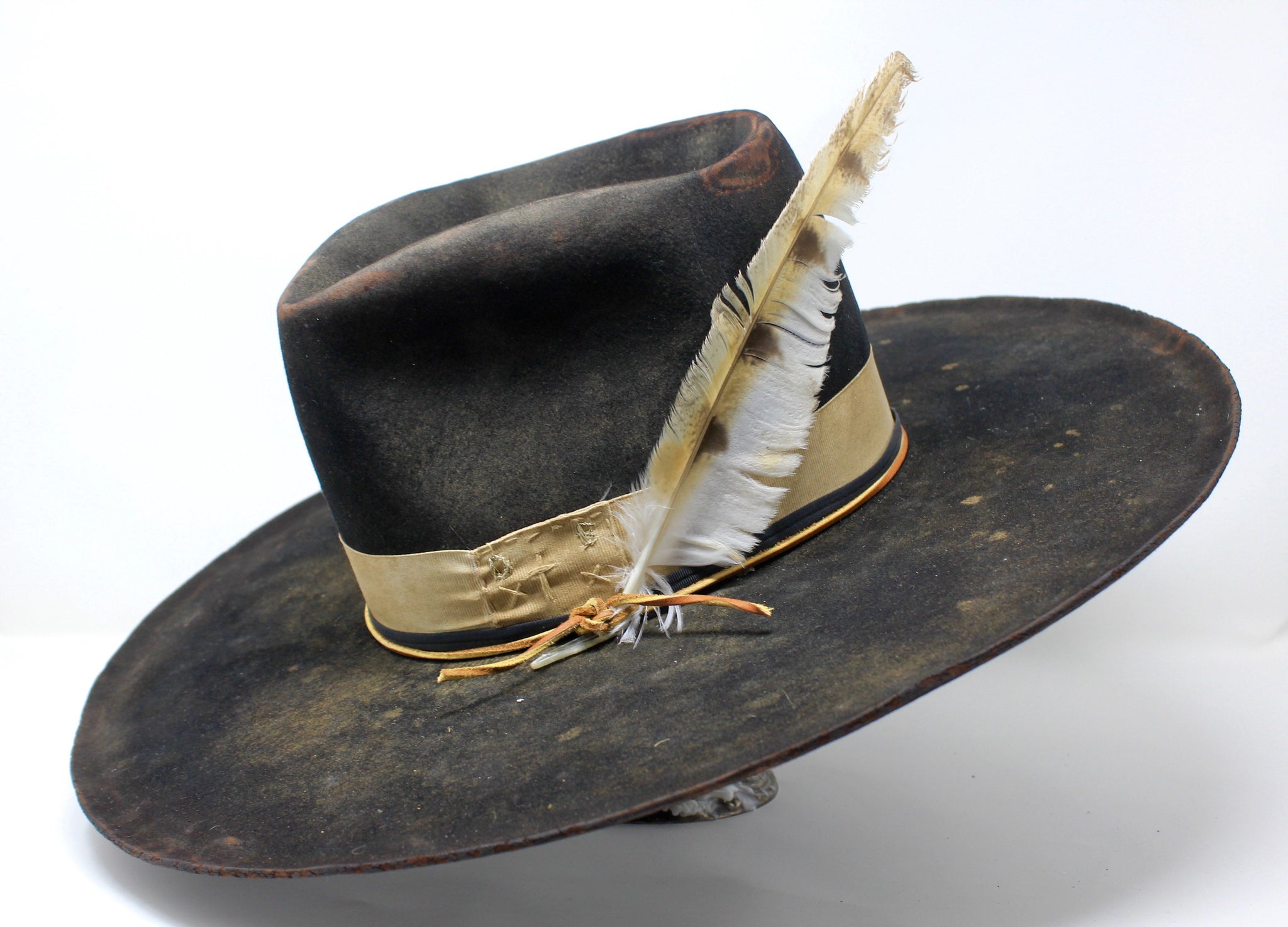 Left view of the handmade Night Hawk western hat by Lone Hawk Hats, crafted in distressed beaver felt with hand-stitched banding, one-of-a-kind design.