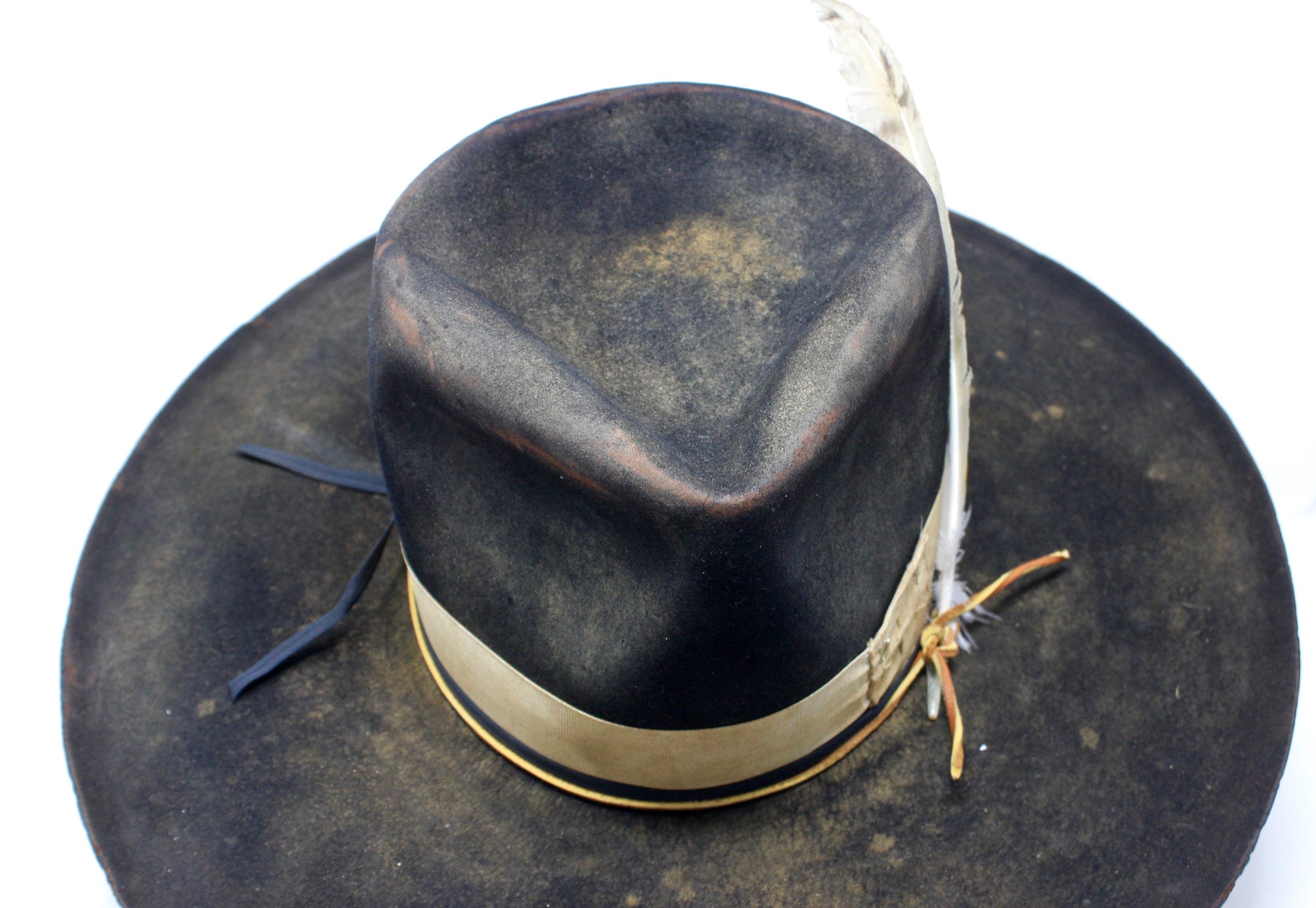top font view of the Handmade Night Hawk western hat by Lone Hawk Hats, crafted in distressed beaver felt with hand-stitched banding, one-of-a-kind design.