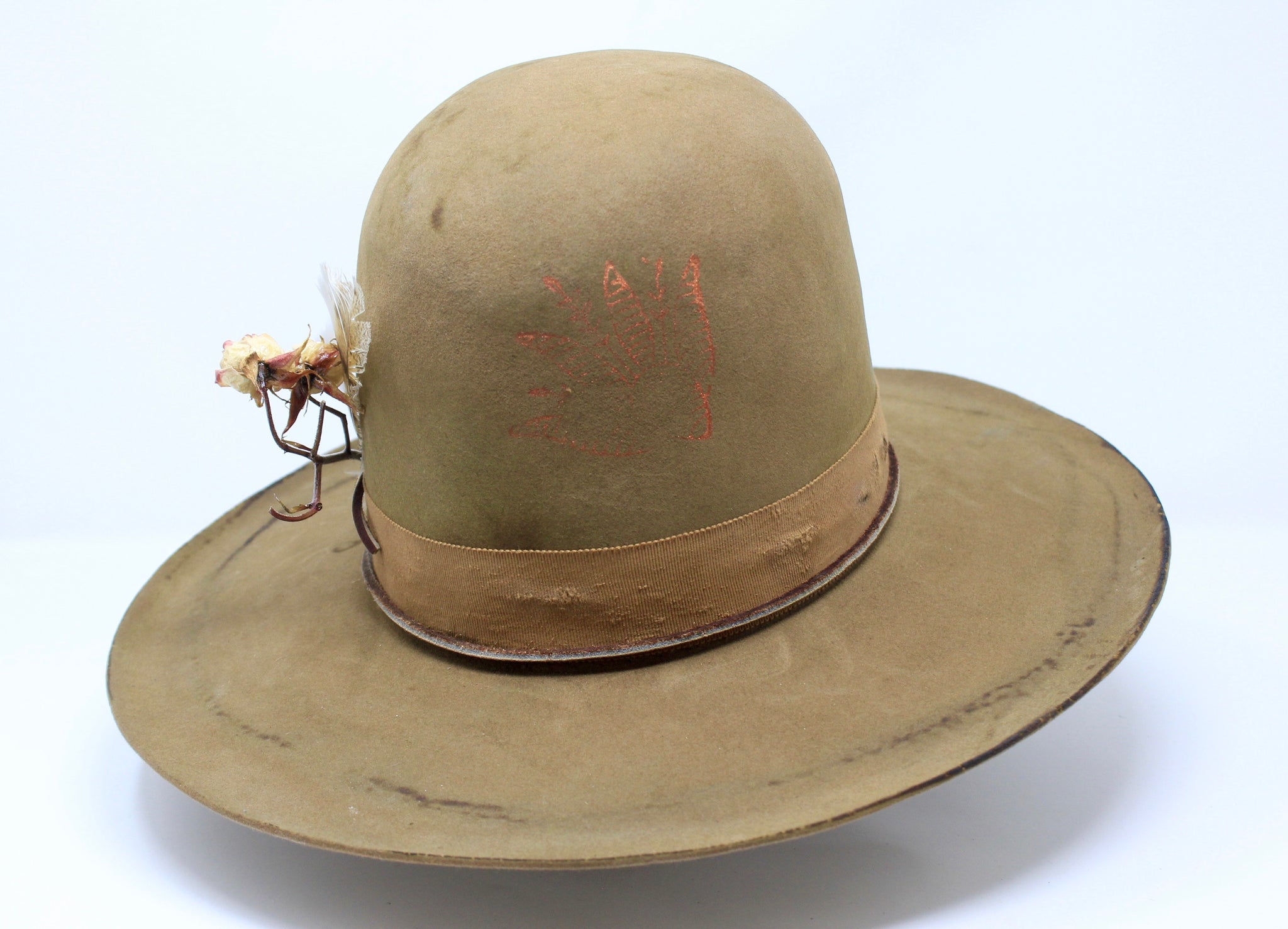 Front view of the Cree Mountain hat by Lone Hawk Hats featuring a tall open crown, flat brim with a slight pencil roll, hand-sewn band, feather accents, and light distressing.