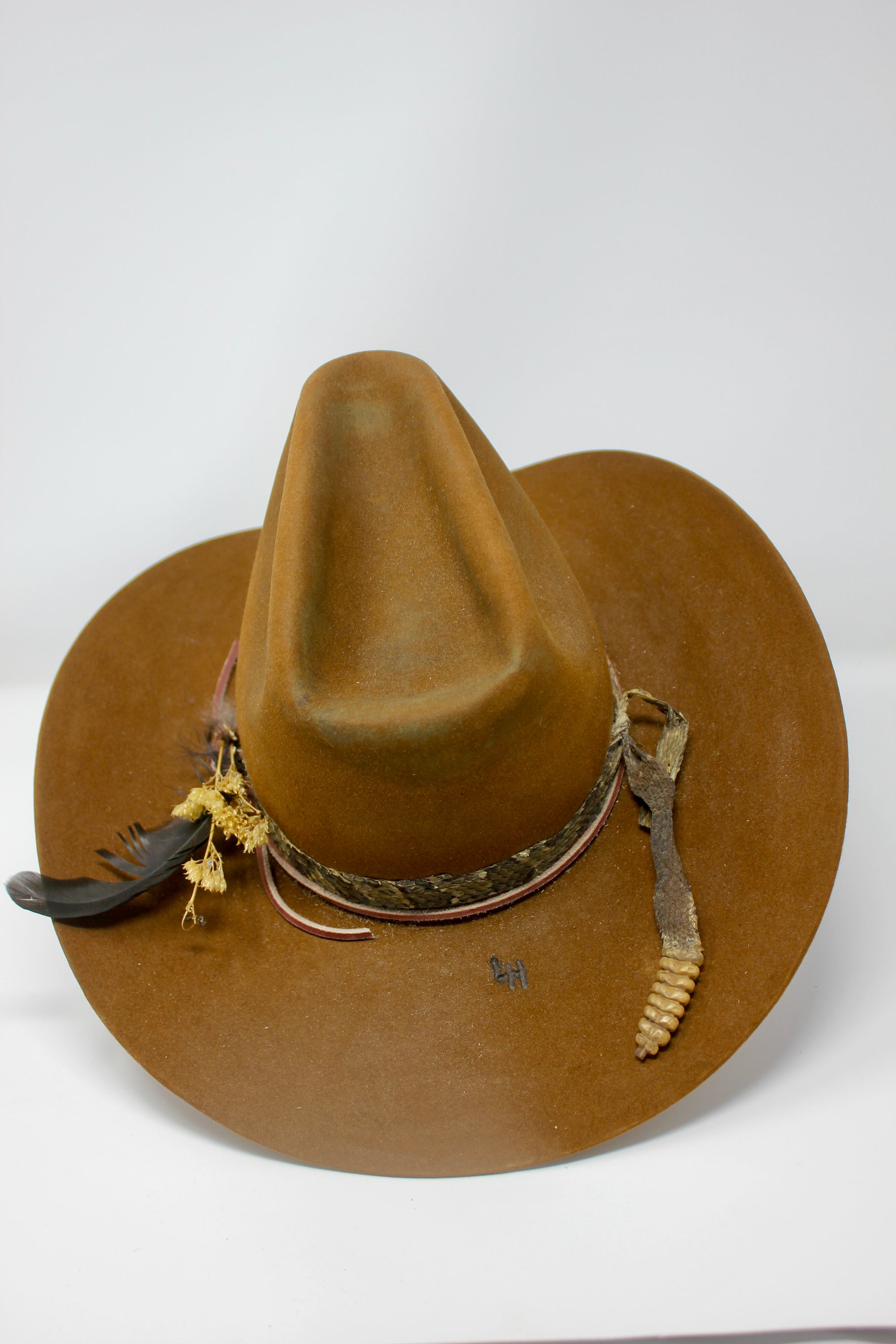 back top view of The HighHawk Snake Bite hat by Lone Hawk Hats featuring chestnut beaver felt, an authentic vintage snakeskin band, and a classic hi-low crown.