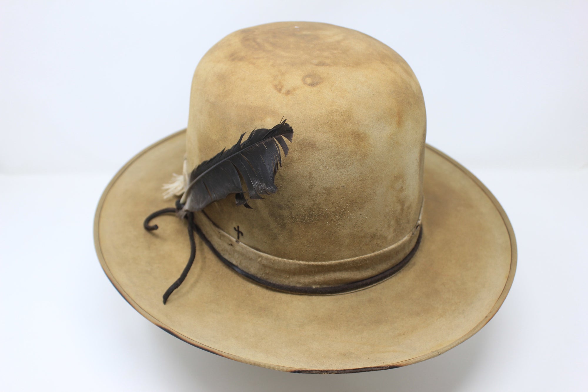 Back view of the Desert Hawk hat by Lone Hawk Hats featuring a fully distressed Dust Bowl-era style, tall open crown, flat brim, and hand-sewn band.