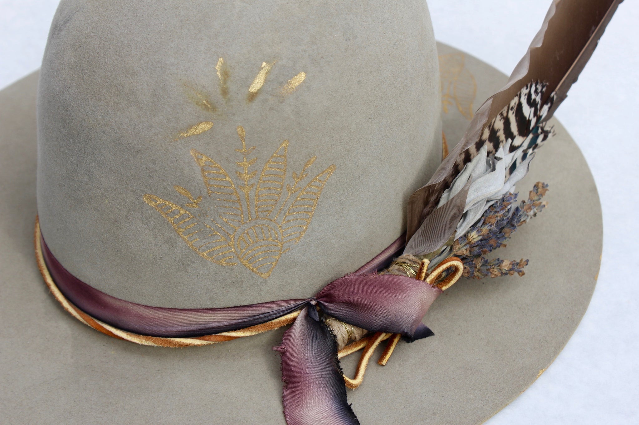 Top view of the hand-painted gold accents, hand-dyed silk ribbon, on the Block Print Open Crown hat by Lone Hawk Hats featuring antique Indian wood block prints, and a classic open crown design.