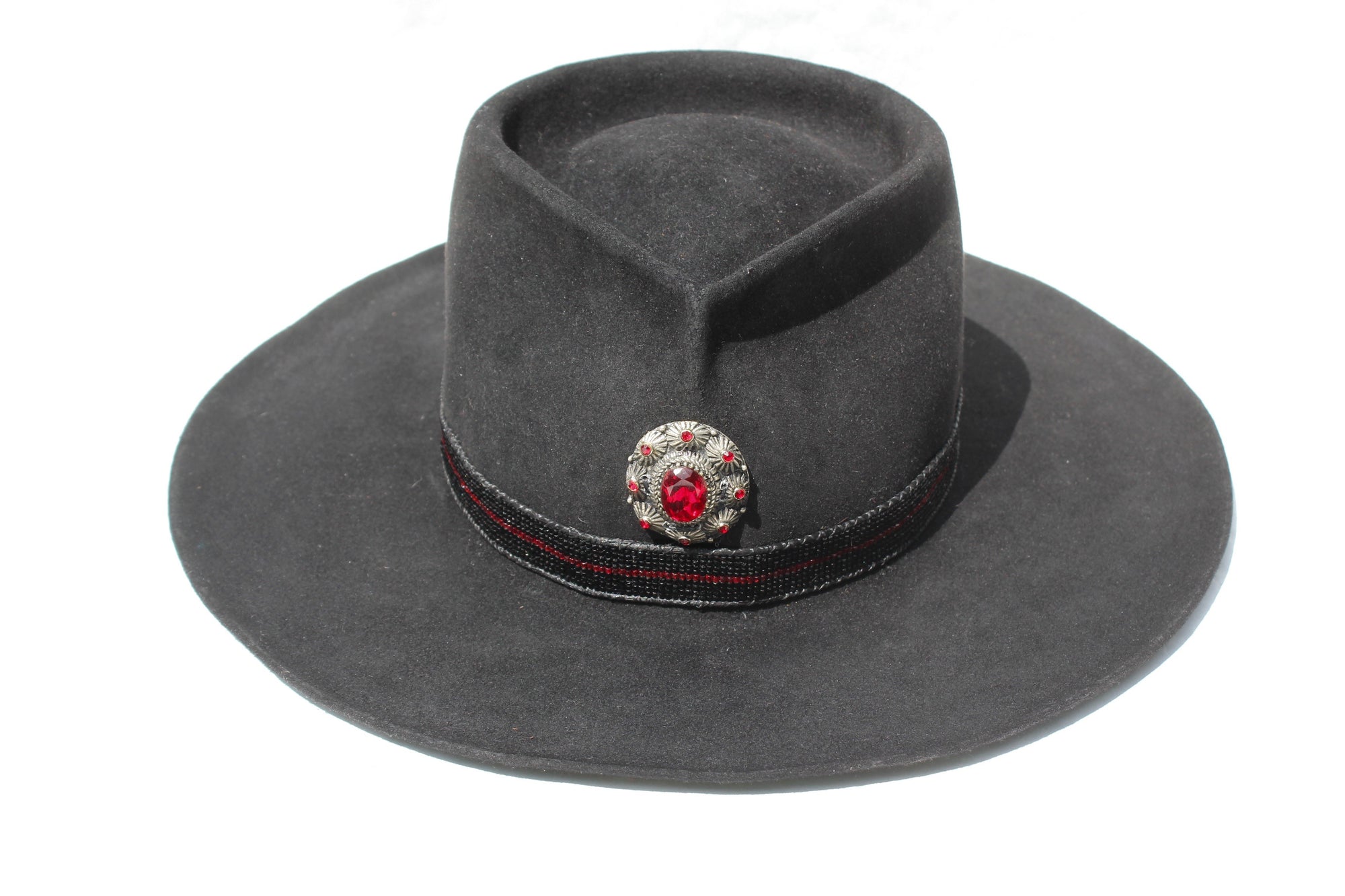 Front view of The Saturday Night Fever custom Lone Hawk hat, a handmade beaver fur blend western hat featuring a tall tear-drop crown, hand-beaded band with horsehair detail, and antique English medallion.
