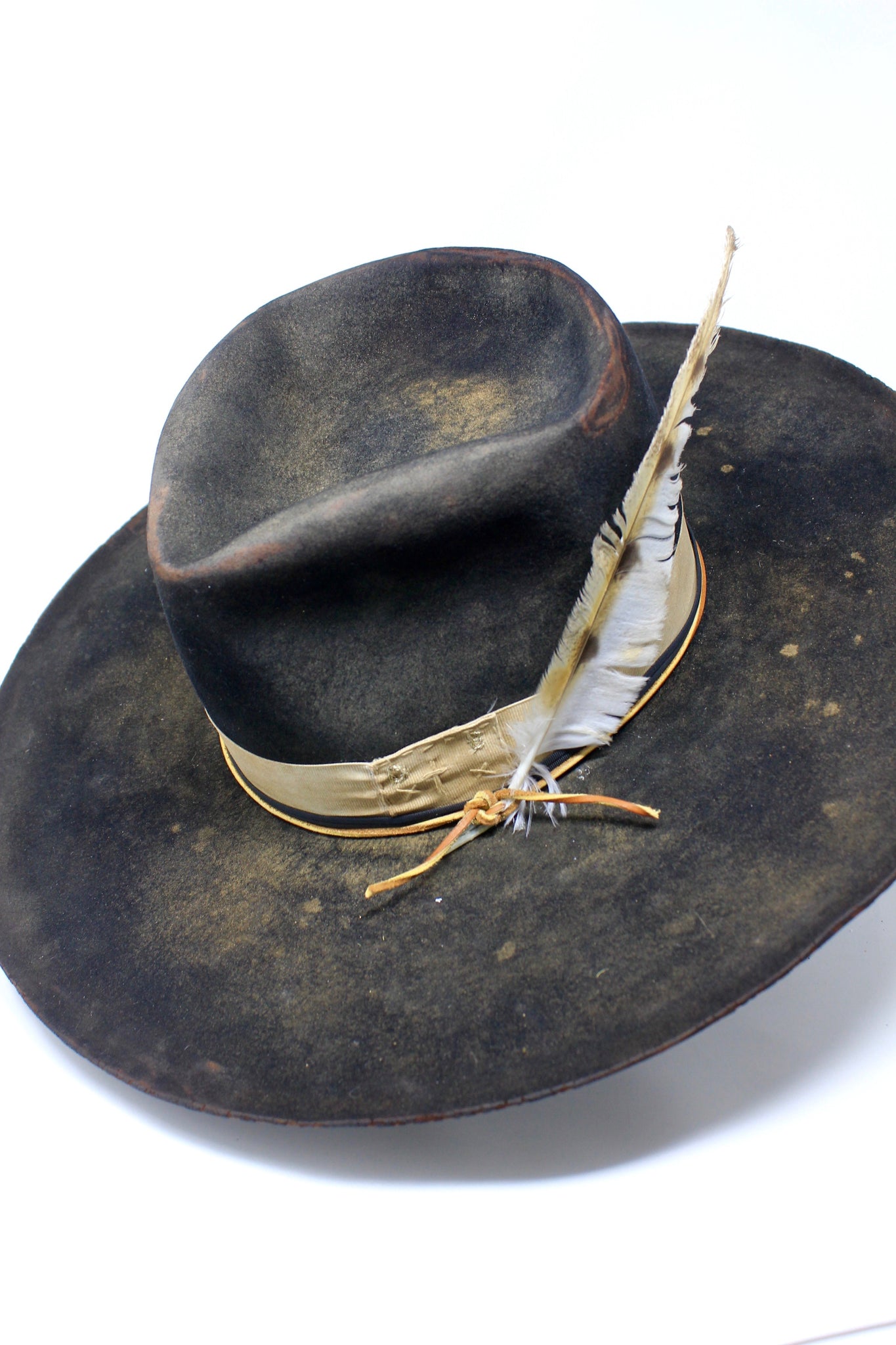 top left view of the Handmade Night Hawk western hat by Lone Hawk Hats, crafted in distressed beaver felt with hand-stitched banding, one-of-a-kind design.