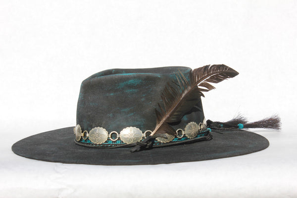 Left view of the Plum Crazy hat by Lone Hawk Hats featuring hand-dyed purple vintage beaver felt, an open crown, and a hand-beaded floral band.