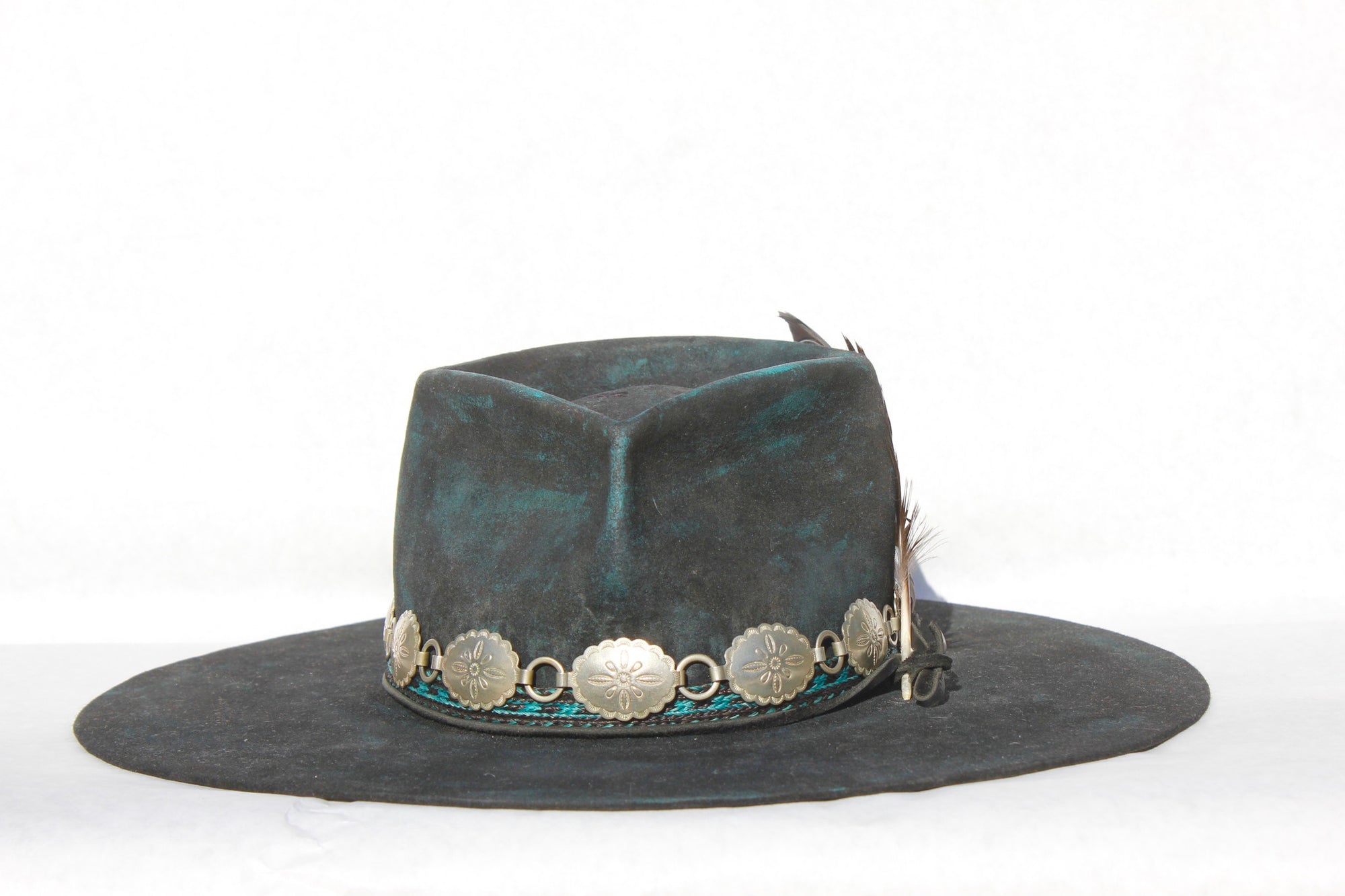 Front view of the Plum Crazy hat by Lone Hawk Hats featuring hand-dyed purple vintage beaver felt, an open crown, and a hand-beaded floral band.